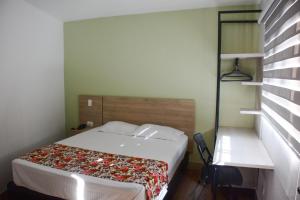 Krevet ili kreveti u jedinici u okviru objekta Hotel Poma Rosa