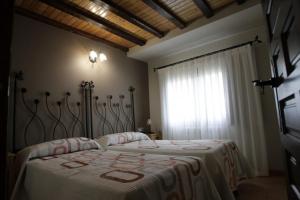 
Cama o camas de una habitación en Casona Santa Coloma
