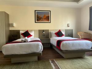 Voodi või voodid majutusasutuse Hotel Wawa toas