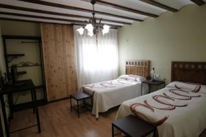
Cama o camas de una habitación en Casona Santa Coloma
