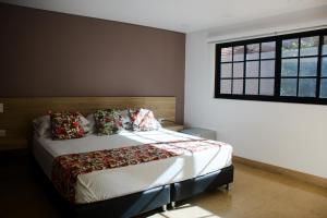 Krevet ili kreveti u jedinici u okviru objekta Hotel Poma Rosa