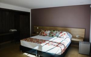Krevet ili kreveti u jedinici u okviru objekta Hotel Poma Rosa