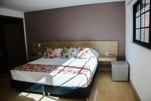 Krevet ili kreveti u jedinici u okviru objekta Hotel Poma Rosa