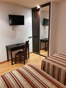 Postel nebo postele na pokoji v ubytování Hospedium Hotel Vittoria Colonna