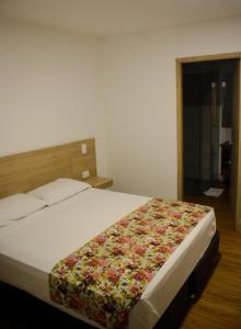 Krevet ili kreveti u jedinici u okviru objekta Hotel Poma Rosa