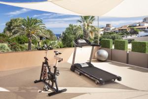 an exercise bike on the roof of a house at Hotel Corallaro in Santa Teresa Gallura