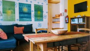 a living room with a table and a couch at LA CASITA / CASA DE CAMPO in Santa Gadea