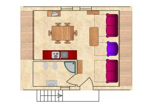 a floor plan of a room with a table and chairs at Chalet Presanella in Temù