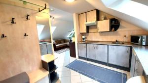 Kuchyňa alebo kuchynka v ubytovaní A Mecsek Gyöngye Apartmanhaz
