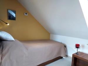 Posteľ alebo postele v izbe v ubytovaní A Mecsek Gyöngye Apartmanhaz