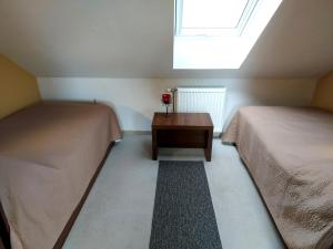 Posteľ alebo postele v izbe v ubytovaní A Mecsek Gyöngye Apartmanhaz
