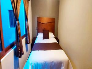 Voodi või voodid majutusasutuse Hotel Suites La Fortuna toas