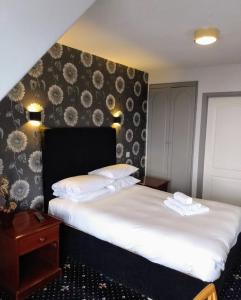 Voodi või voodid majutusasutuse Marine Hotel toas