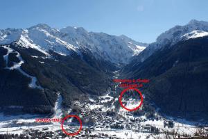 a mountain valley with snow covered mountains at Chalet Presanella in Temù
