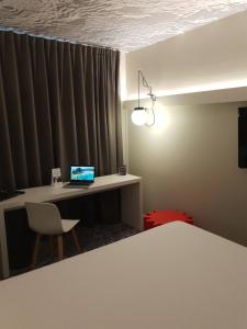 
A bed or beds in a room at ibis Luxembourg Aeroport
