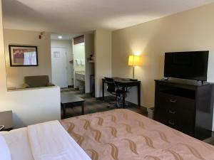 A bed or beds in a room at Quality Inn Montgomery South