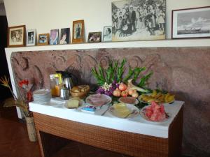 a table with food on top of it at Hotel Victoria in Hanga Roa