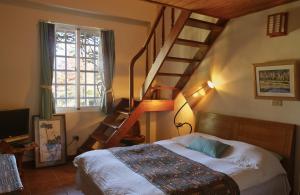 Llit o llits en una habitació de Wisdom Garden Home Stay