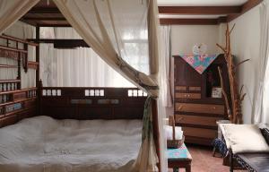 Llit o llits en una habitació de Wisdom Garden Home Stay
