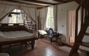Postel nebo postele na pokoji v ubytování Wisdom Garden Home Stay