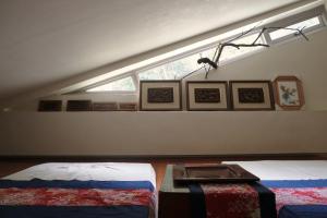 Llit o llits en una habitació de Wisdom Garden Home Stay