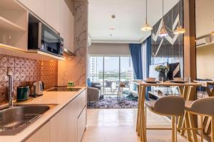 a kitchen with a sink and a counter top at Veranda Pattaya Luxury Design Balcony with seaview in Na Jomtien