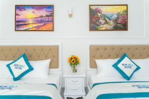 Postel nebo postele na pokoji v ubytování Sun Hill Hotel