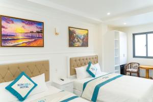 Postel nebo postele na pokoji v ubytování Sun Hill Hotel