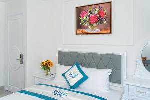 Postel nebo postele na pokoji v ubytování Sun Hill Hotel