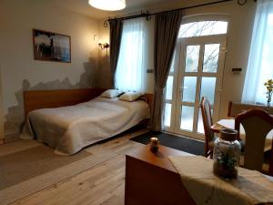 Posteľ alebo postele v izbe v ubytovaní A Mecsek Gyöngye Apartmanhaz