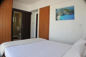 Postel nebo postele na pokoji v ubytování Palm Tree Villas