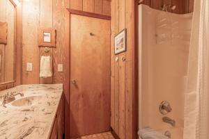 a bathroom with a sink and a shower and a mirror at Amazing Place MCA 1295 - Meredith Lodging in Manzanita
