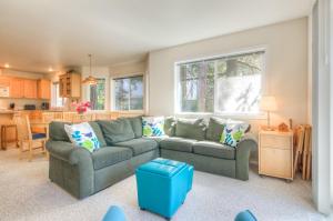 a living room with a couch and a kitchen at 863 Juniper (MCA 499) in Manzanita