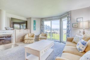 a living room with a couch and a table at Dock of the Bay 108 in Lincoln City