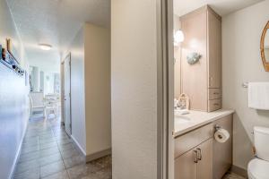 a bathroom with a sink and a toilet in a room at Dock of the Bay 108 in Lincoln City +34 photos
