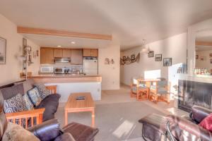 a living room with a couch and a table at Dock of the Bay 305 in Lincoln City