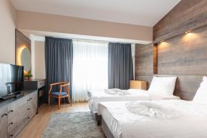 Ein Bett oder Betten in einem Zimmer der Unterkunft Hotel Sport, Resort Mavrovo