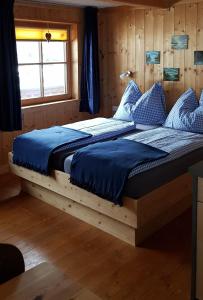 A bed or beds in a room at Fasserhof