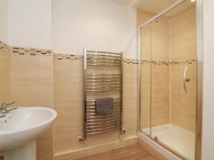 a bathroom with a shower and a sink at The Outlook in Taunton