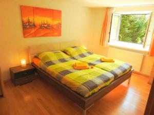 A bed or beds in a room at Linz Apartment Comfort-Size