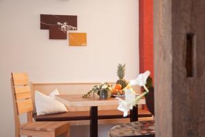 a table with fruit on it in a room at Appartements Fliana Mathon/Ischgl in Ischgl