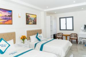 Postel nebo postele na pokoji v ubytování Sun Hill Hotel