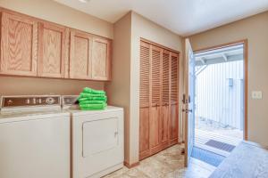 a laundry room with a washer and dryer at Red Cedar Lane 60 - Meredith Lodging in Sunriver +55 photos