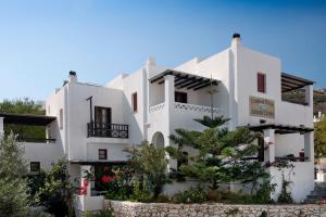 a white building with trees in front of it at DIMITRIOS in Skiros