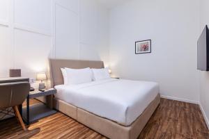 Postel nebo postele na pokoji v ubytování Wesley Hotel
