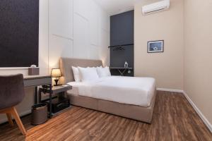 Postel nebo postele na pokoji v ubytování Wesley Hotel