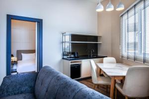 a living room with a couch and a table at Wesley Hotel in Bukit Mertajam