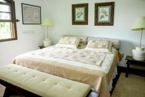 En eller flere senge i et værelse på Fazendinha Nossa Senhora da Medalha Milagrosa