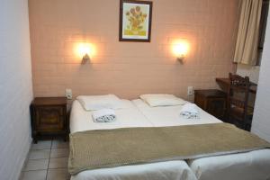 Postel nebo postele na pokoji v ubytování Hotel Plaza + 37 fotografií