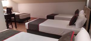 Postel nebo postele na pokoji v ubytování Hospedium Hotel Vittoria Colonna